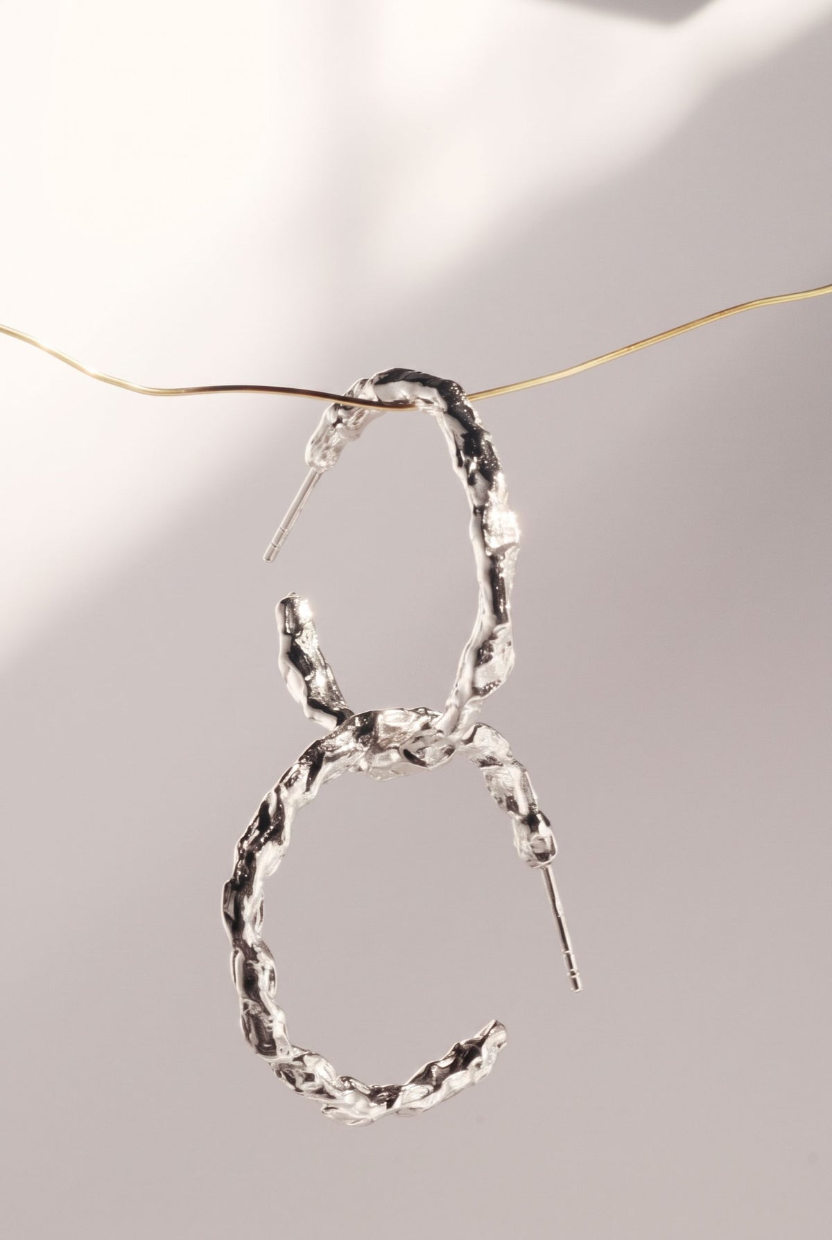 Mercurio Origen Hoops, silver version, hoop earrings by Bocavolcan