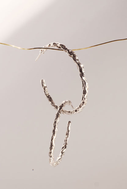 Saturno Origen Hoops, silver version, hoop earrings by Bocavolcan